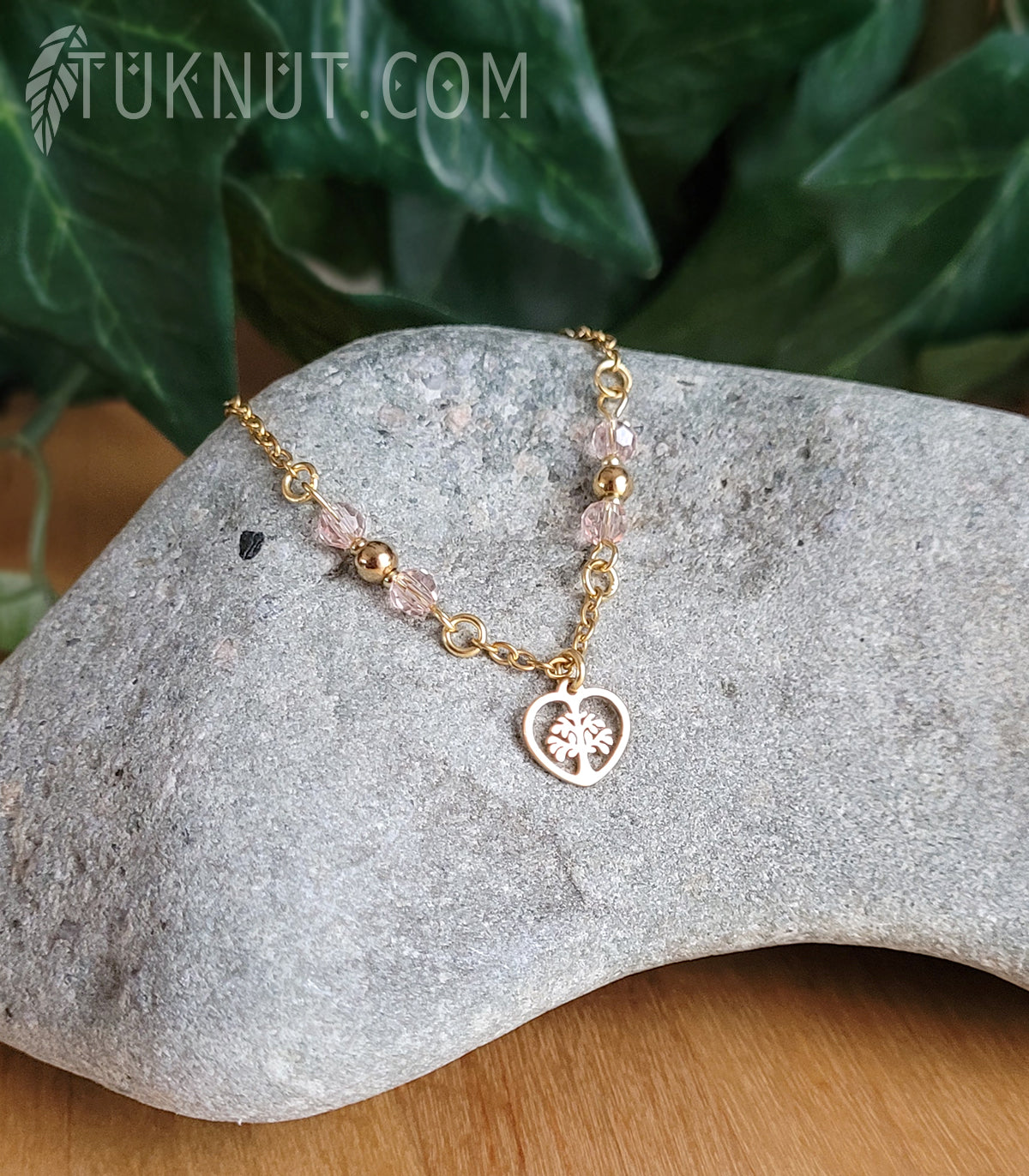 Bracelet d'inspiration autochtone en acier inoxydable avec arbre de vie dans un coeur doré avec cristal rose (couleurs : or et rose) TUKNUT