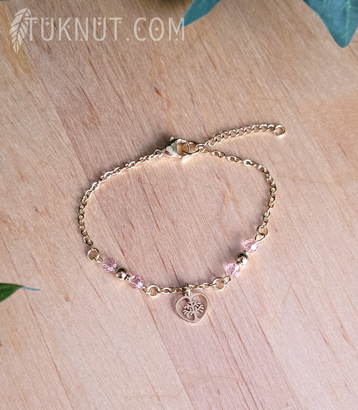 Bracelet d'inspiration autochtone en acier inoxydable avec arbre de vie dans un coeur doré avec cristal rose (couleurs : or et rose) TUKNUT