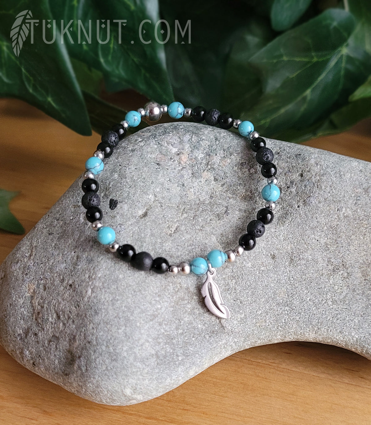 Bracelet extensible d'inspiration autochtone, avec onyx, pierre volcanique, turquoise et breloque (plume) en acier inoxydable (couleurs : noir, turquoise et argent) TUKNUT