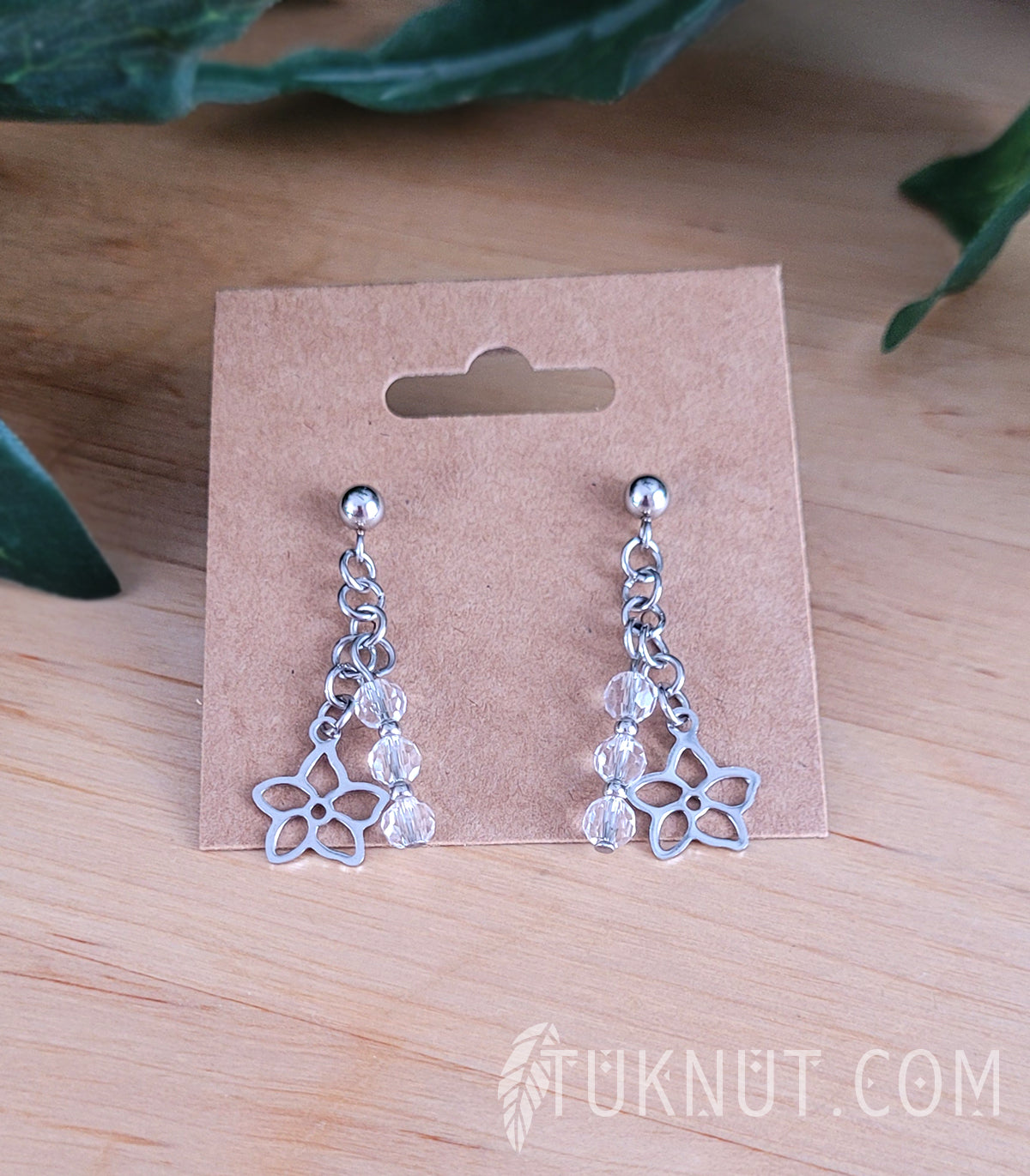 Boucles d'oreilles (tiges et papillons) avec pendentif (petite fleur) en acier inoxydable et cristal (couleurs : argent et transparent) TUKNUT
