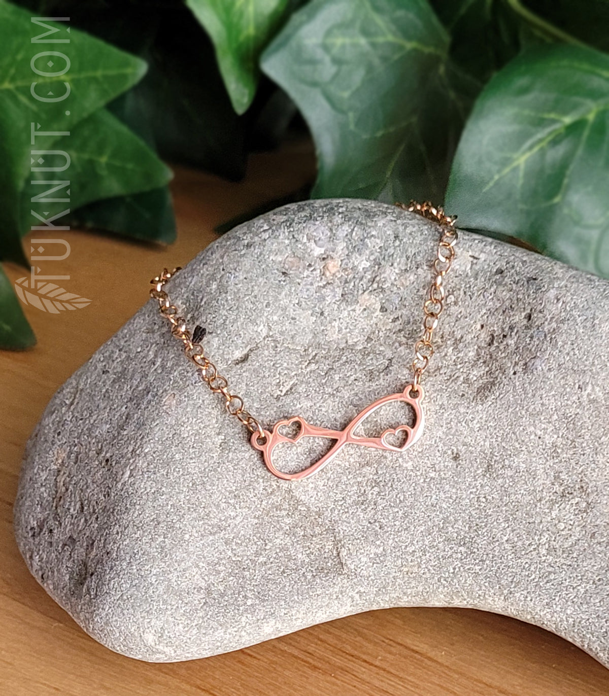 Bracelet en acier inoxydable avec symbole Infini et petits coeurs (couleur : or rose) TUKNUT
