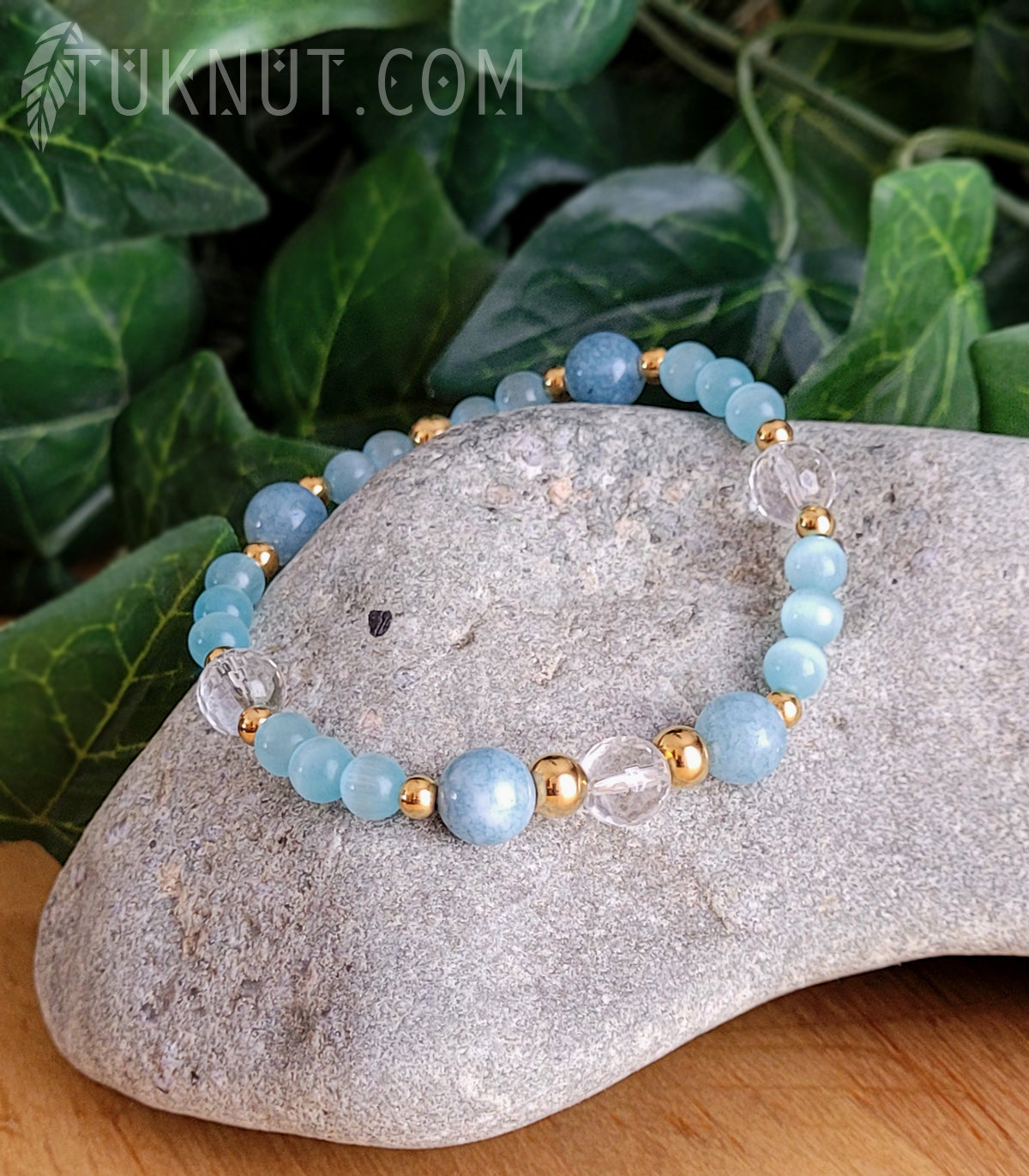 Bracelet extensible avec pierre de soleil, verre (oeil de chat bleu), cristal et acier inoxydable (couleurs : bleu, or et transparent) TUKNUT