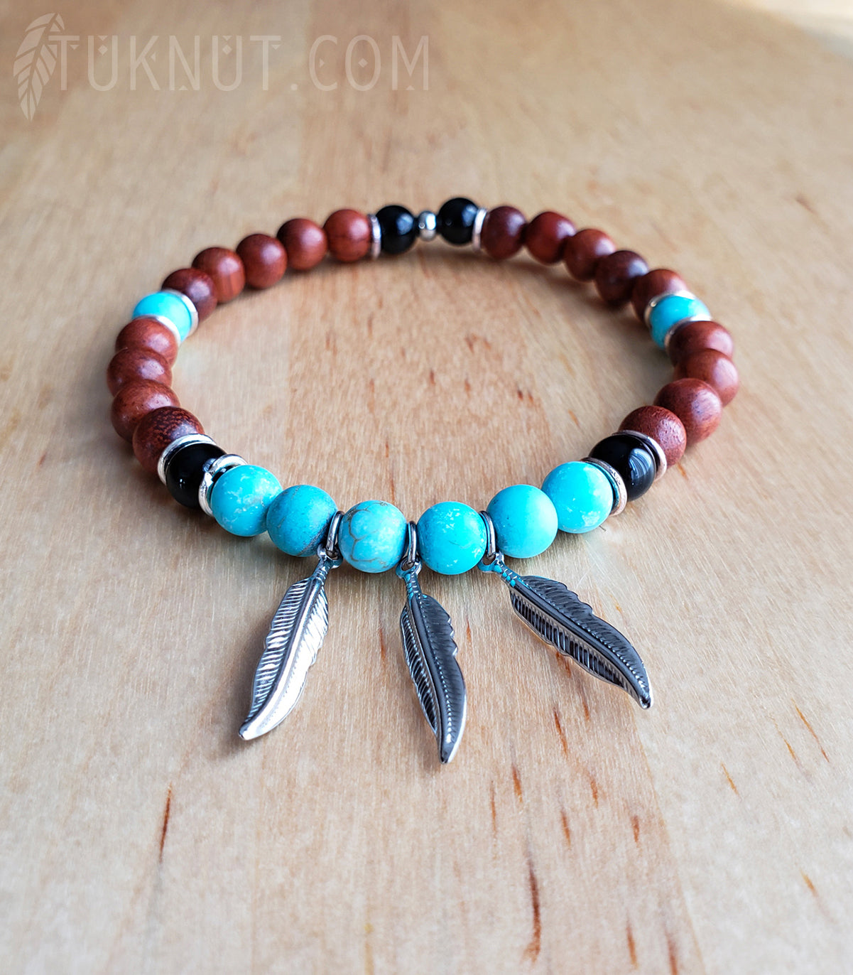 Bracelet extensible d'inspiration autochtone, avec plumes en acier inoxydable, turquoise, onyx et bois de rose (couleurs : turquoise, brun, noir et argent) TUKNUT