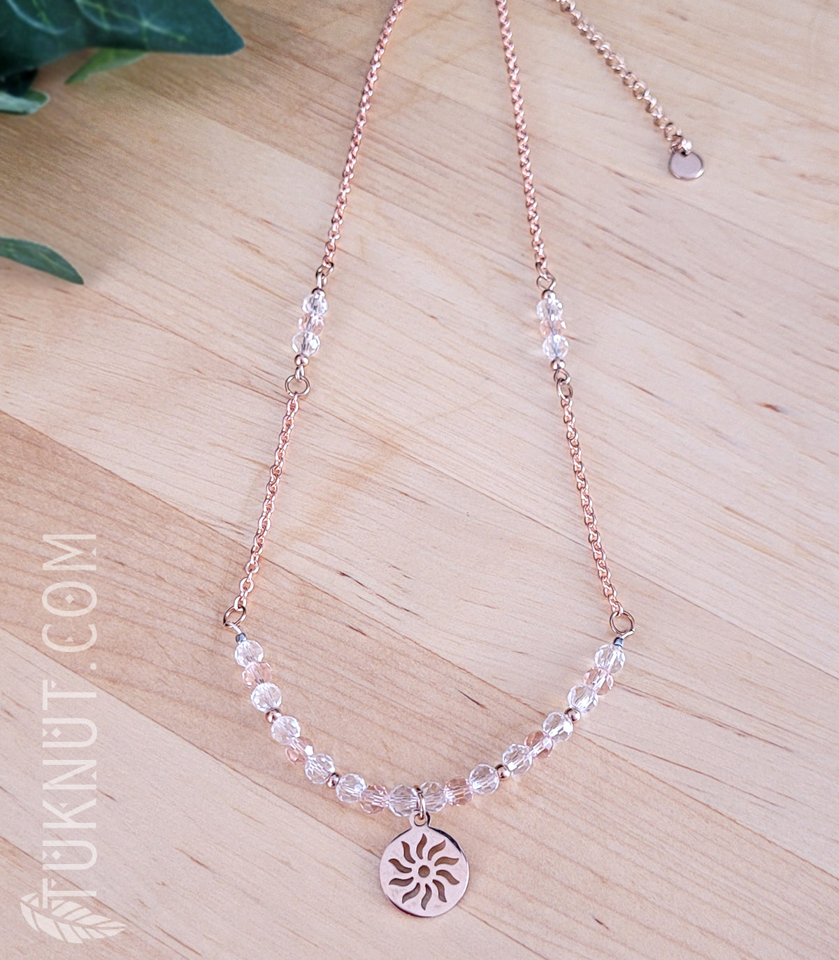 Collier d'inspiration autochtone avec pendentif (soleil) en acier inoxydable avec cristal (couleurs : rose, translucide et or rose) TUKNUT