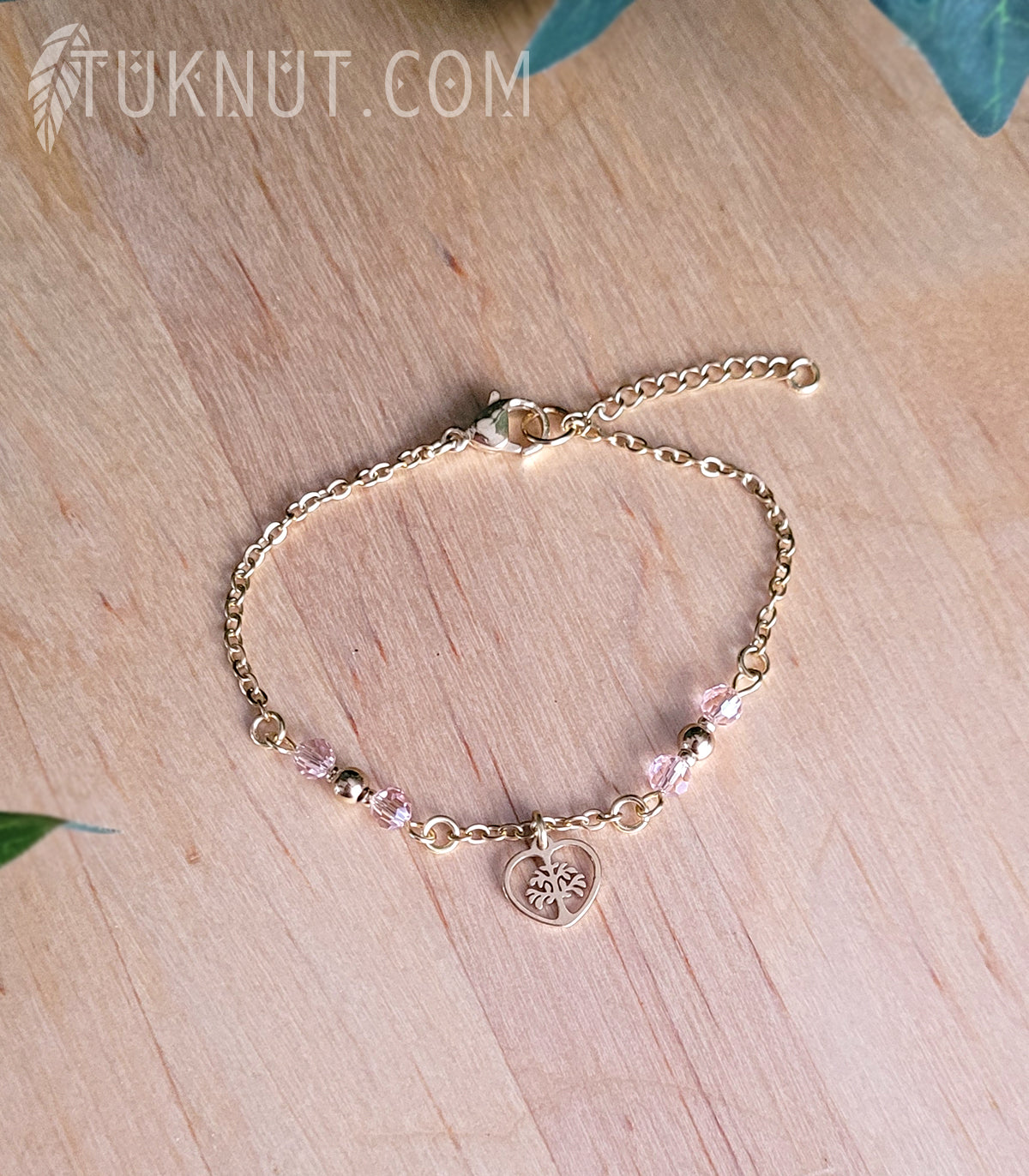 Bracelet d'inspiration autochtone en acier inoxydable avec arbre de vie dans un coeur doré avec cristal rose (couleurs : or et rose) TUKNUT