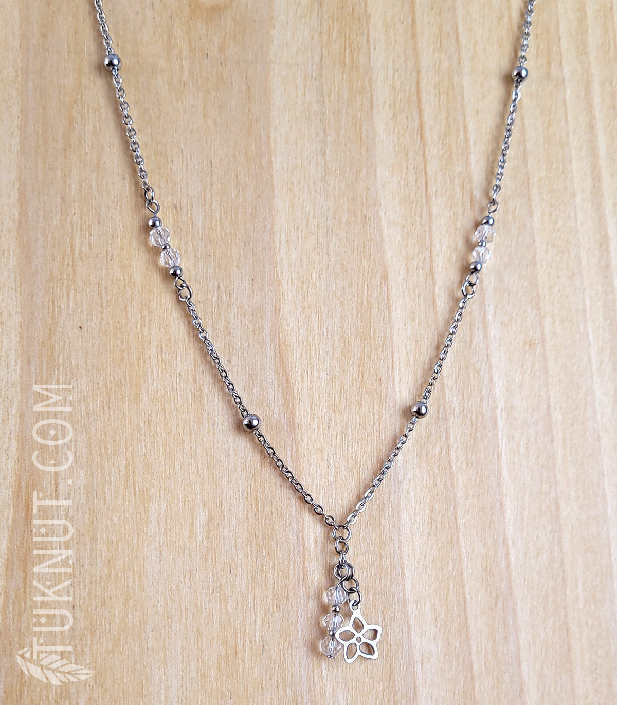 Collier avec pendentif (petite fleur) en acier inoxydable avec cristal (couleurs : argent et translucide) TUKNUT