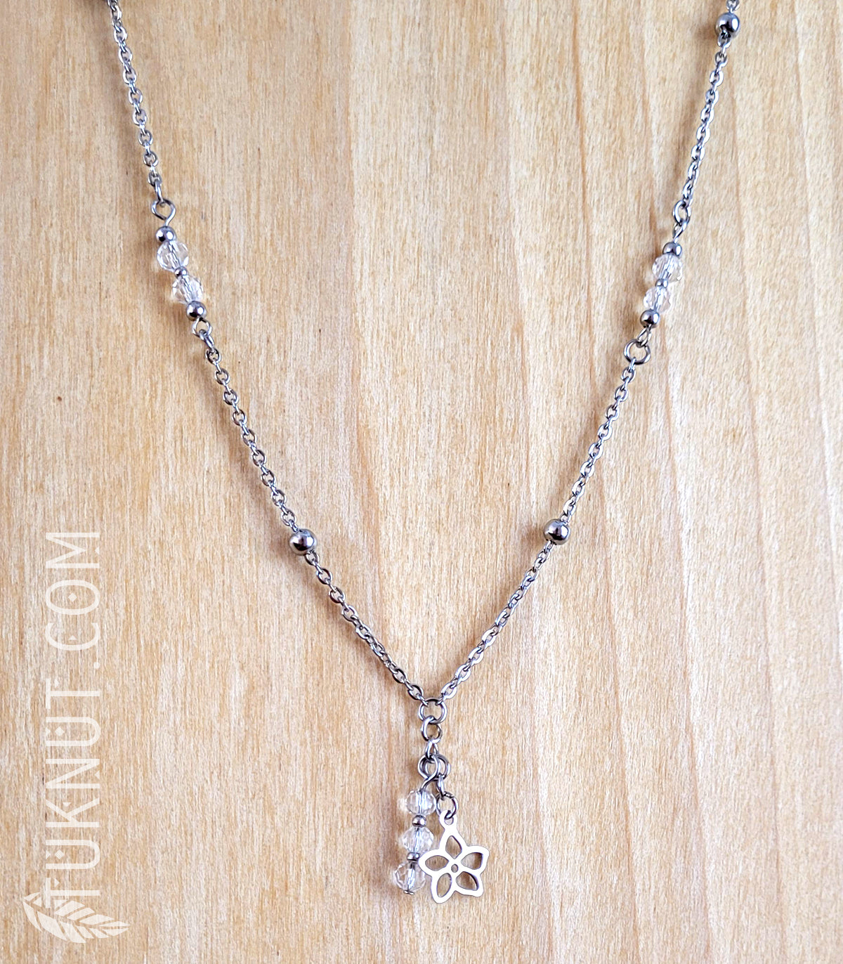 Collier avec pendentif (petite fleur) en acier inoxydable avec cristal (couleurs : argent et translucide) TUKNUT
