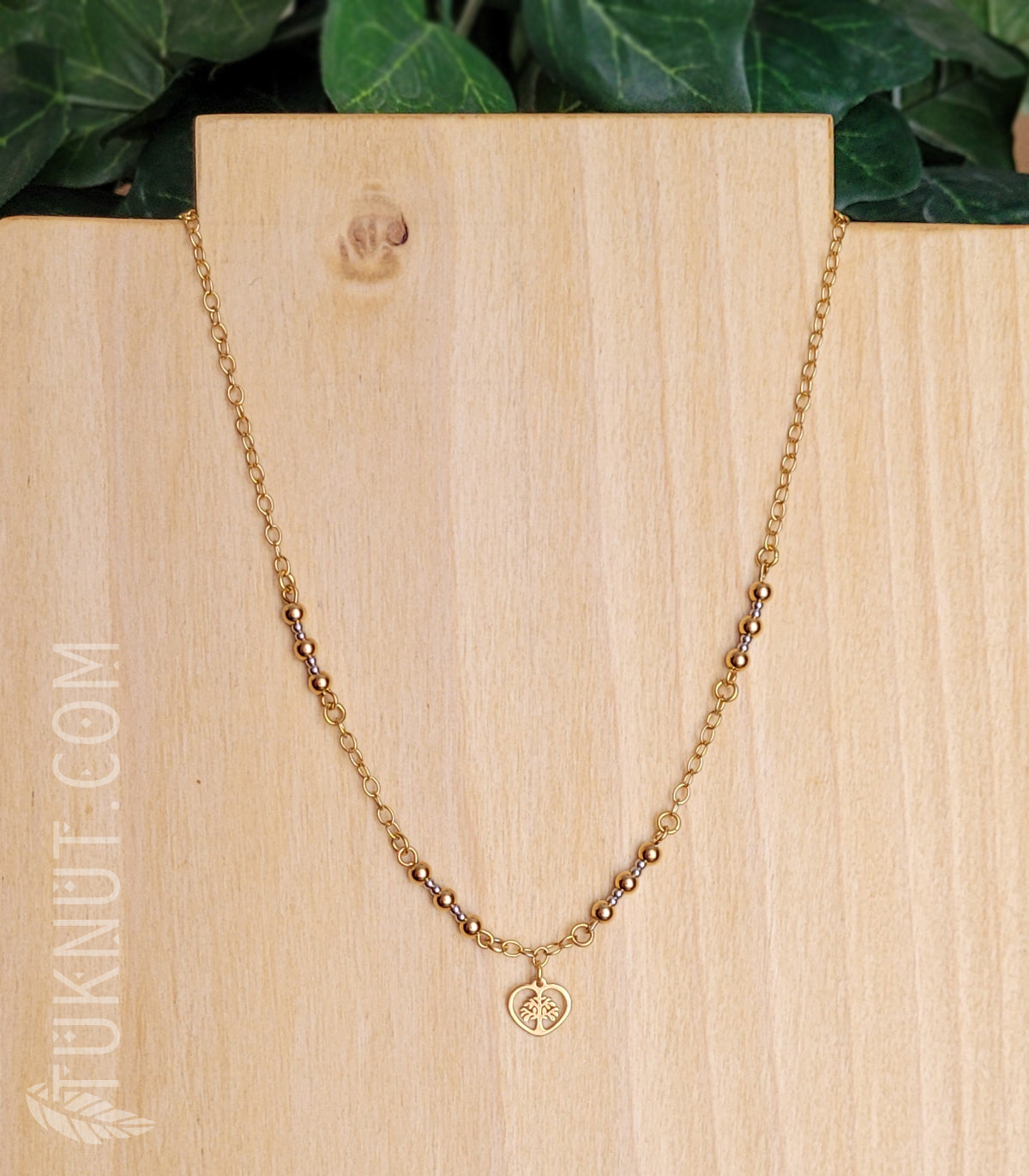 Collier d'inspiration autochtone avec pendentif (arbre de vie dans un coeur doré) en acier inoxydable (couleurs : or et argent) TUKNUT